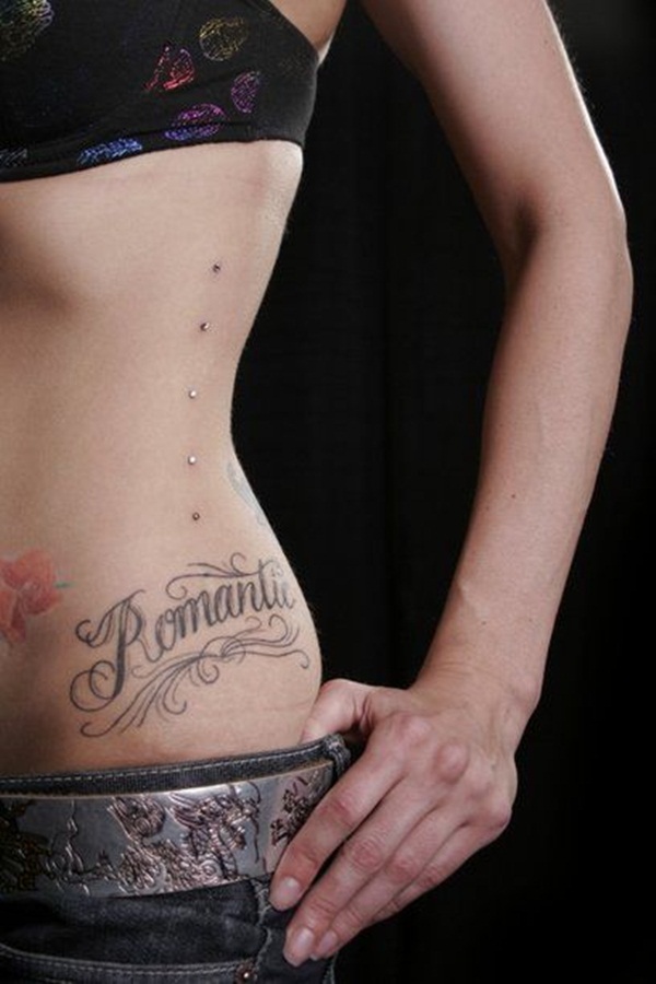 Dermal Anchoring Piercing On Hip And Flower Tattoo