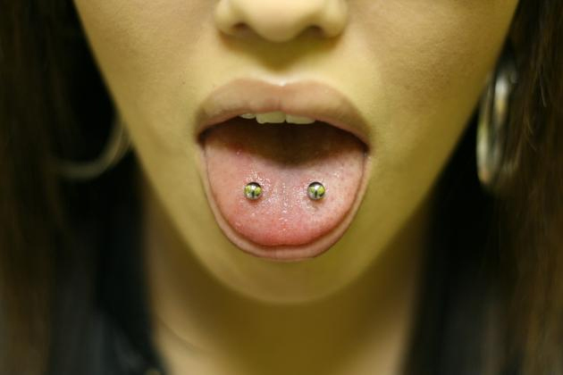 Tongue Piercing With Yellow Barbell