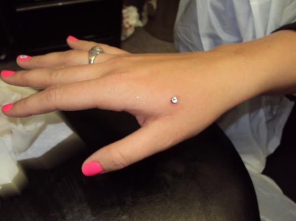 Webbed Hand Piercing With Dermal Anchor On Right Hand