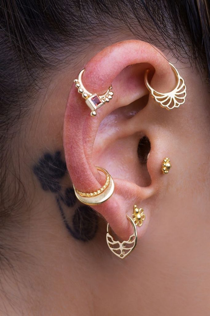 helix-piercing-with-gold-ball-closure-ring-and-upper-lobe-piercing-with-gold-rings