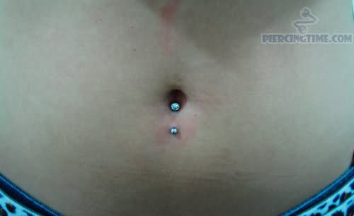 inverse-navel-piercing-with-blue-crystal-rings