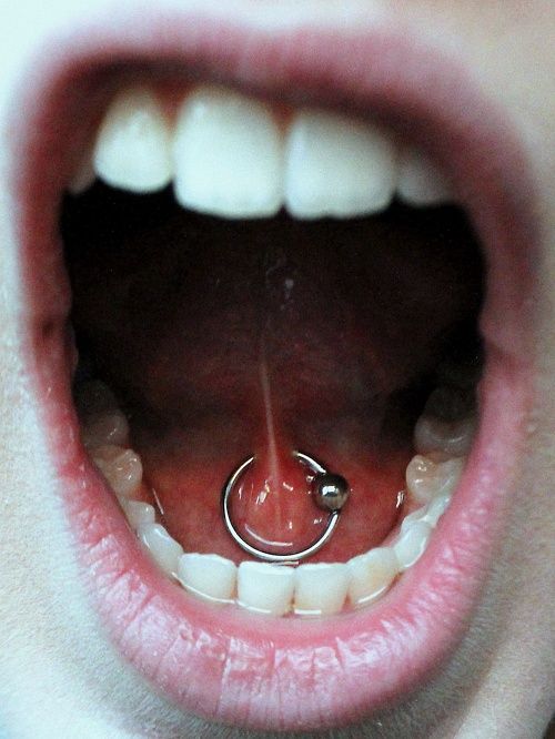 painting-piercing-on-tongue-with-ball-closure-ring